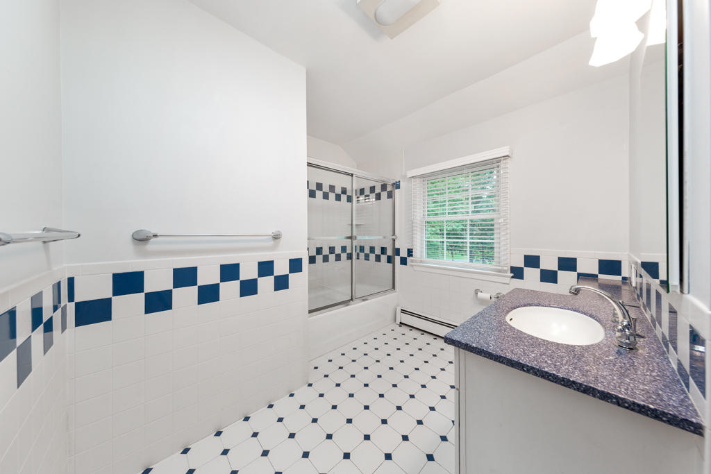 78 Stanton Road Darien, CT 06820 - Photo 24 of 33 a spacious bathroom with a granite countertop sink and a bathtub