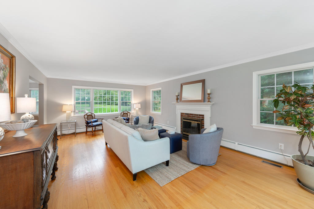 78 Stanton Road Darien, CT 06820 - Photo 4 of 33 a living room with furniture and a fireplace