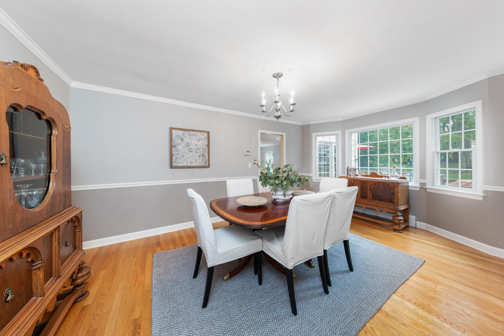 78 Stanton Road Darien, CT 06820 - Photo 6 of 33 a dining room with furniture a rug and a chandelier