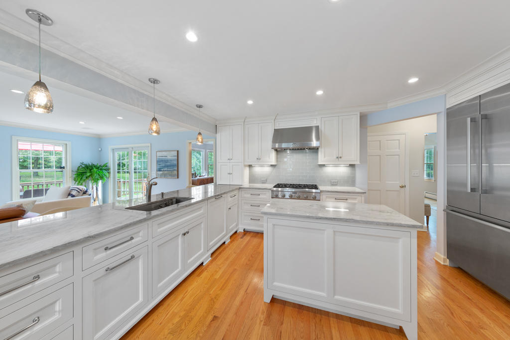 78 Stanton Road Darien, CT 06820 - Photo 8 of 33 a kitchen with stainless steel appliances granite countertop a sink a stove and a refrigerator
