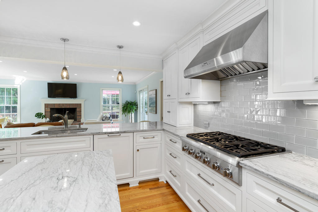 78 Stanton Road Darien, CT 06820 - Photo 9 of 33 a kitchen with stainless steel appliances a sink a stove and cabinets