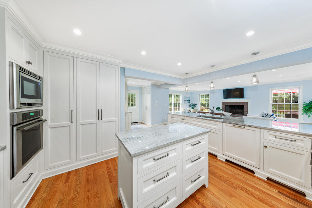 78 Stanton Road Darien, CT 06820 - Photo 10 of 33 a kitchen with white cabinets and stainless steel appliances