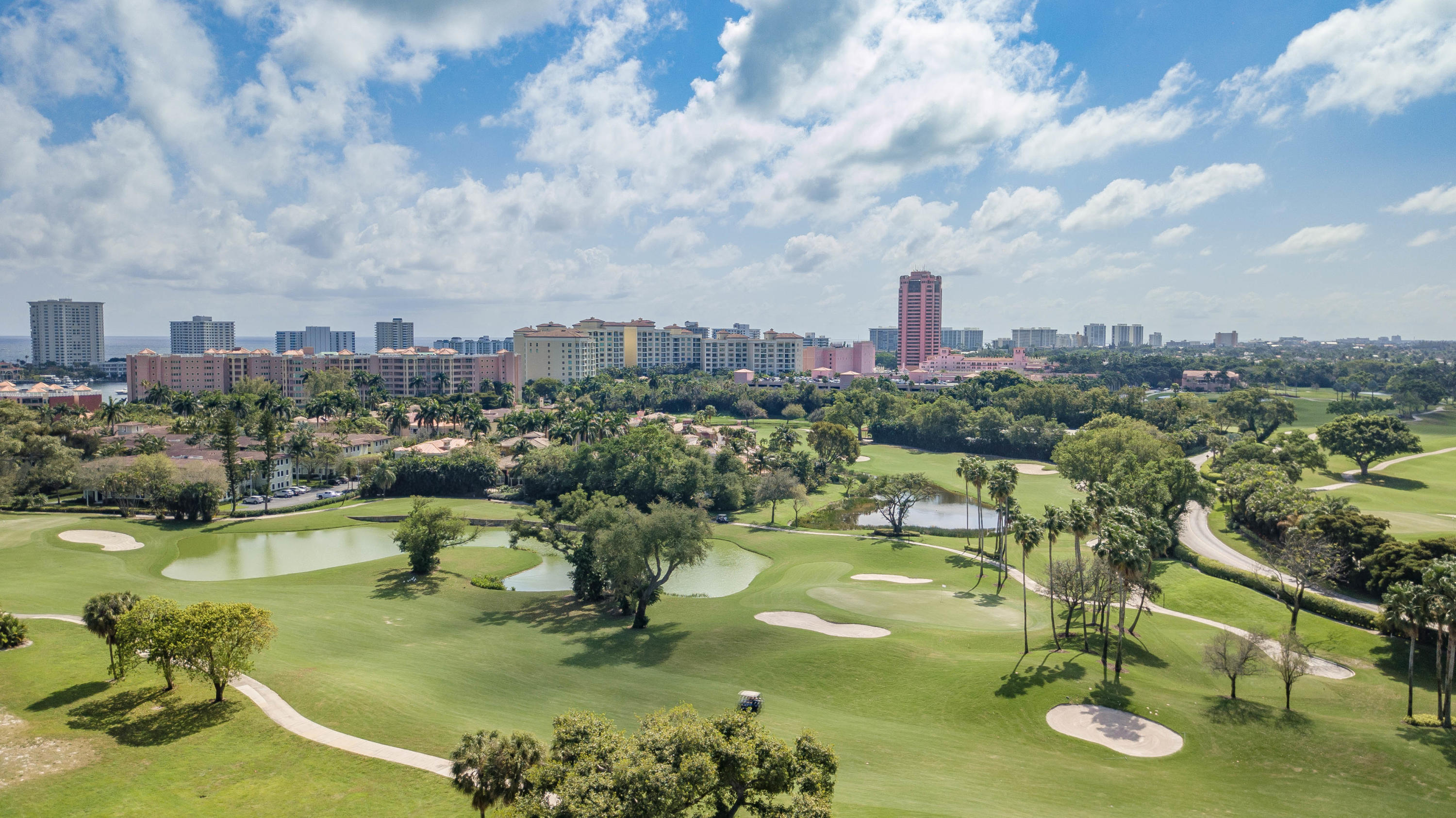 327 East Royal Palm Road, Unit 203 Boca Raton, FL 33432 - Photo 2 of 46 a view of a lake with a city