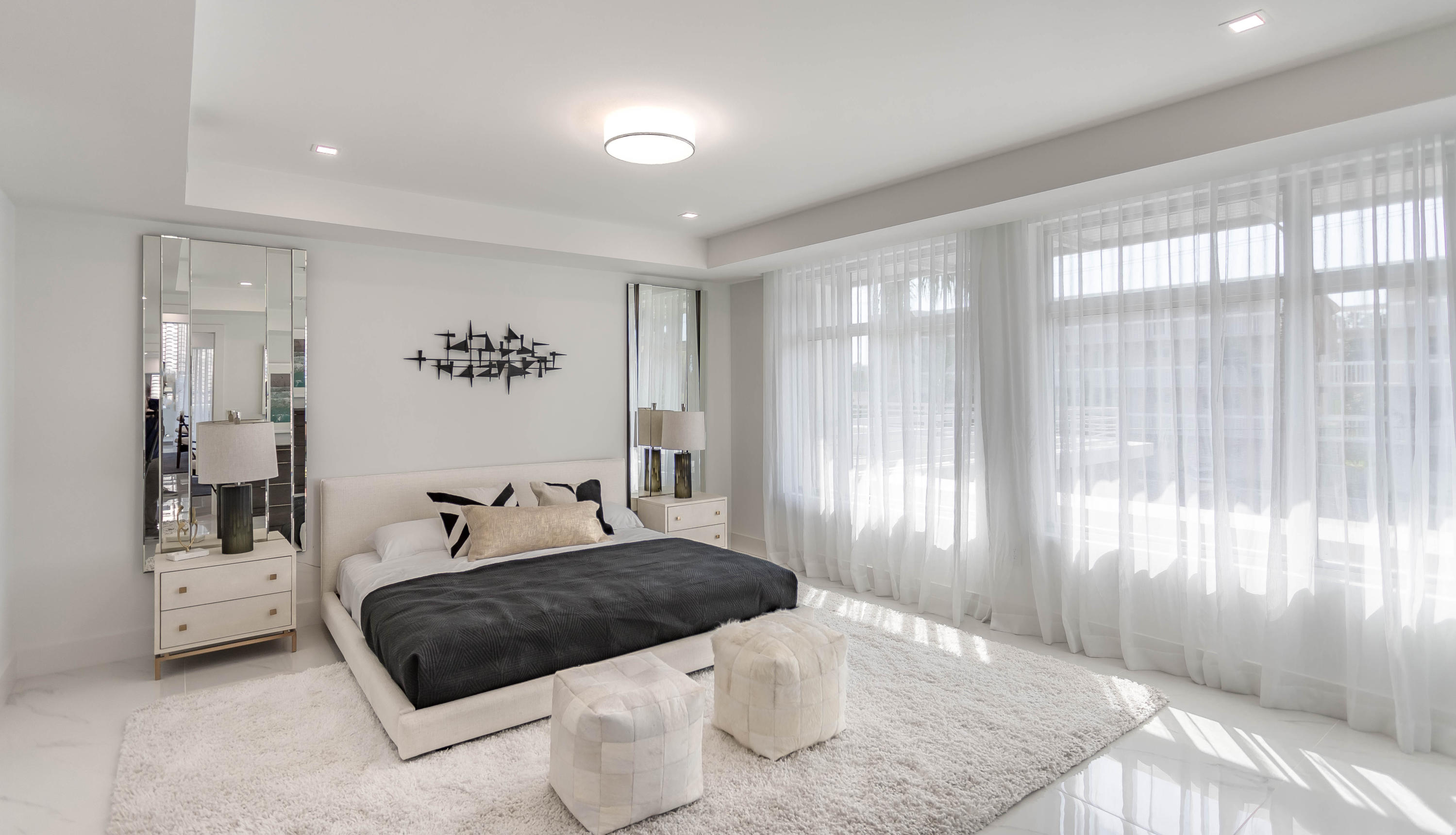 327 East Royal Palm Road, Unit 203 Boca Raton, FL 33432 - Photo 25 of 46 a bedroom with a large bed and a window