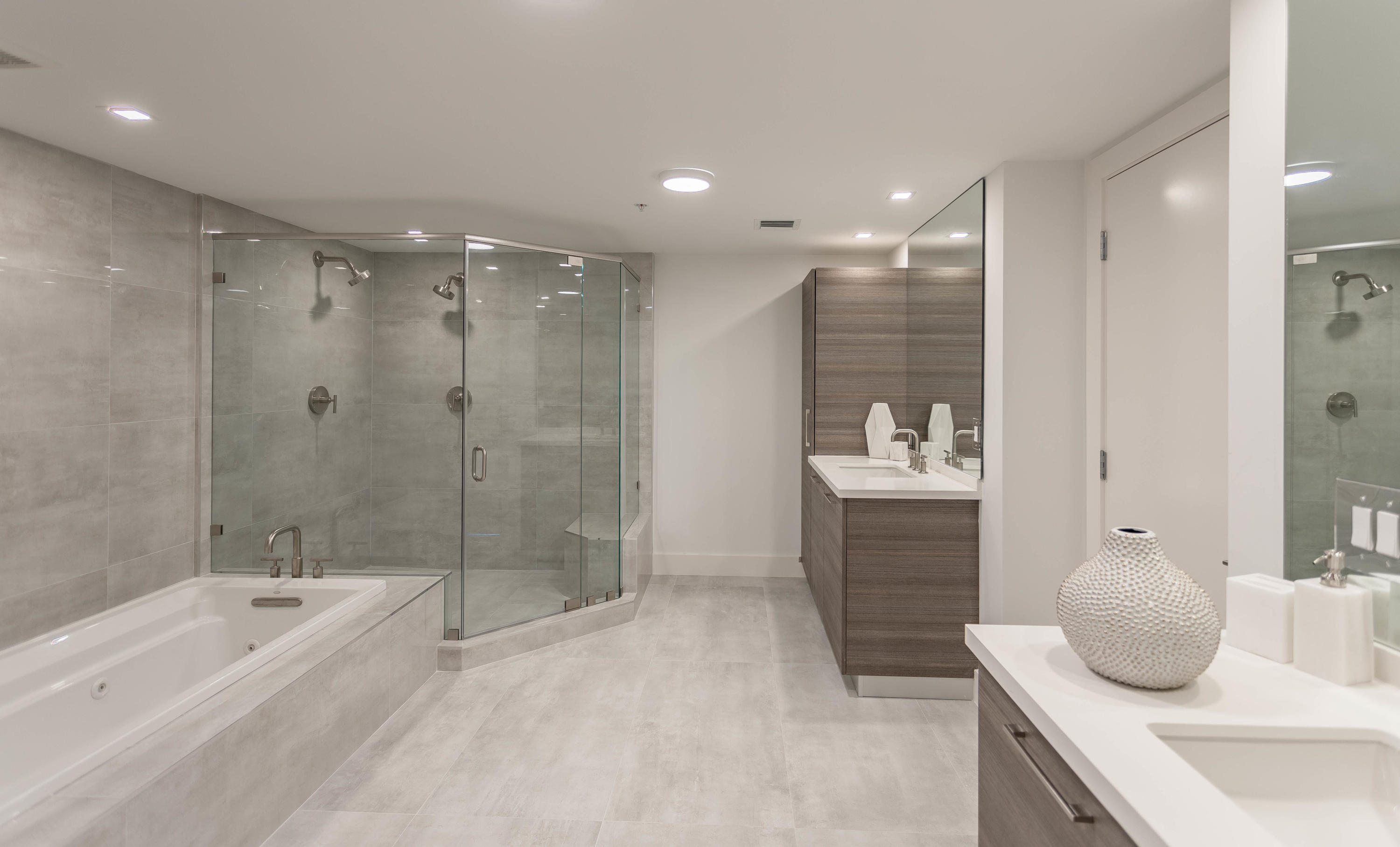 327 East Royal Palm Road, Unit 203 Boca Raton, FL 33432 - Photo 27 of 46 a bathroom with a bathtub shower sink and toilet