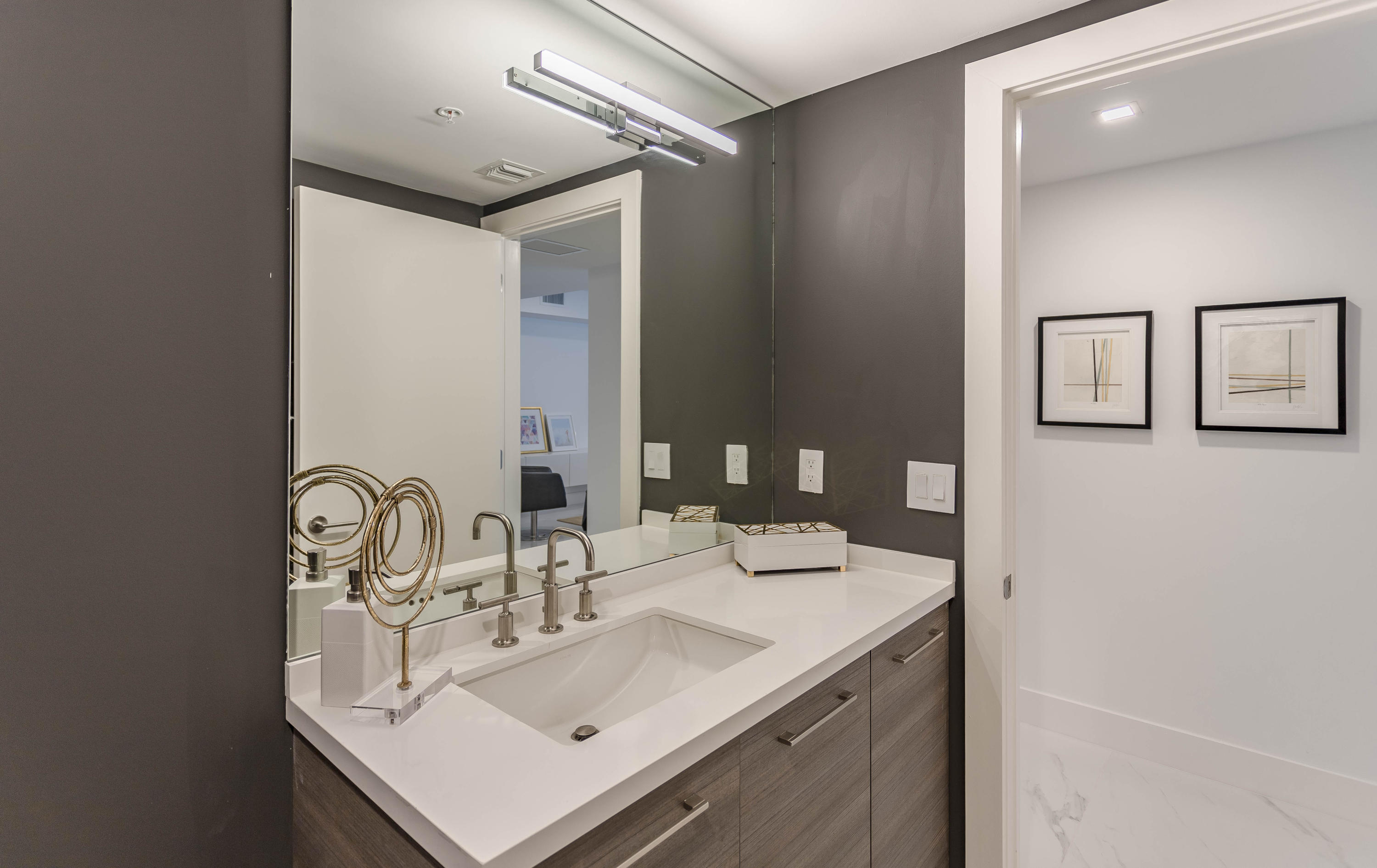 327 East Royal Palm Road, Unit 203 Boca Raton, FL 33432 - Photo 35 of 46 a bathroom with a sink and a mirror