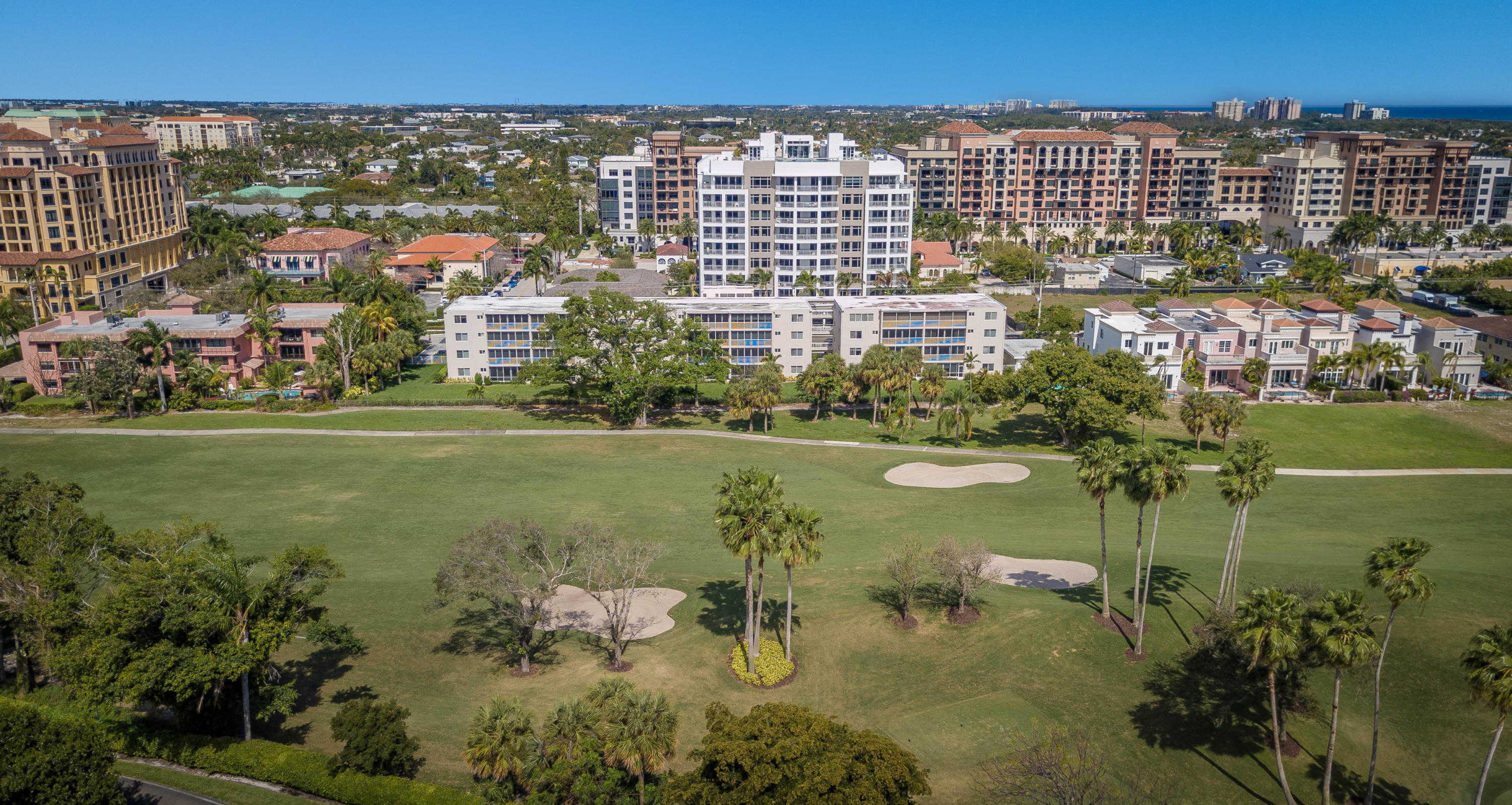 327 East Royal Palm Road, Unit 203 Boca Raton, FL 33432 - Photo 4 of 46 a view of a lake with a building in the background