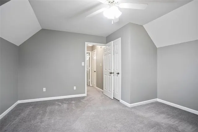 a view of a balcony with wooden floor and fence