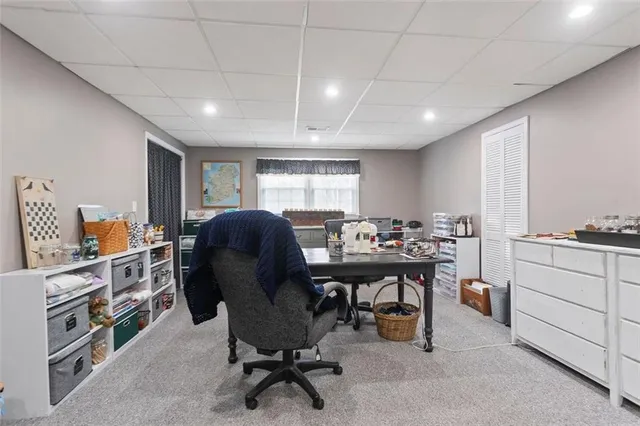 a picture of a bench in front of a window