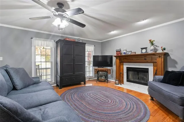 a kitchen with a refrigerator a sink stainless steel appliances and cabinets