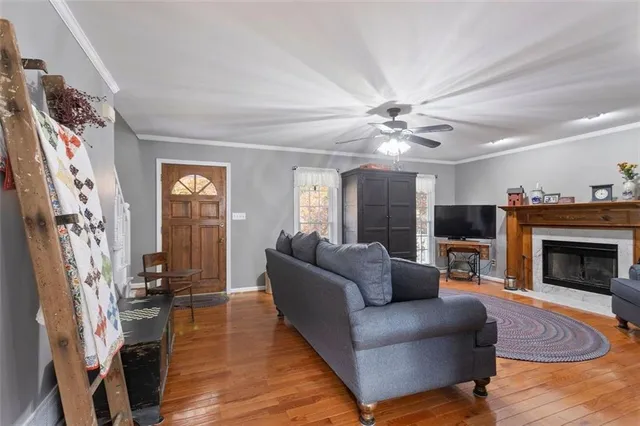 a kitchen with stainless steel appliances granite countertop a sink a stove a microwave a sink and cabinets