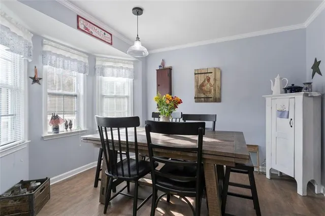 a kitchen with stainless steel appliances granite countertop a sink a stove and a refrigerator