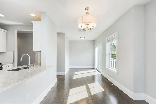 a bathroom with a sink a large mirror and a bathtub