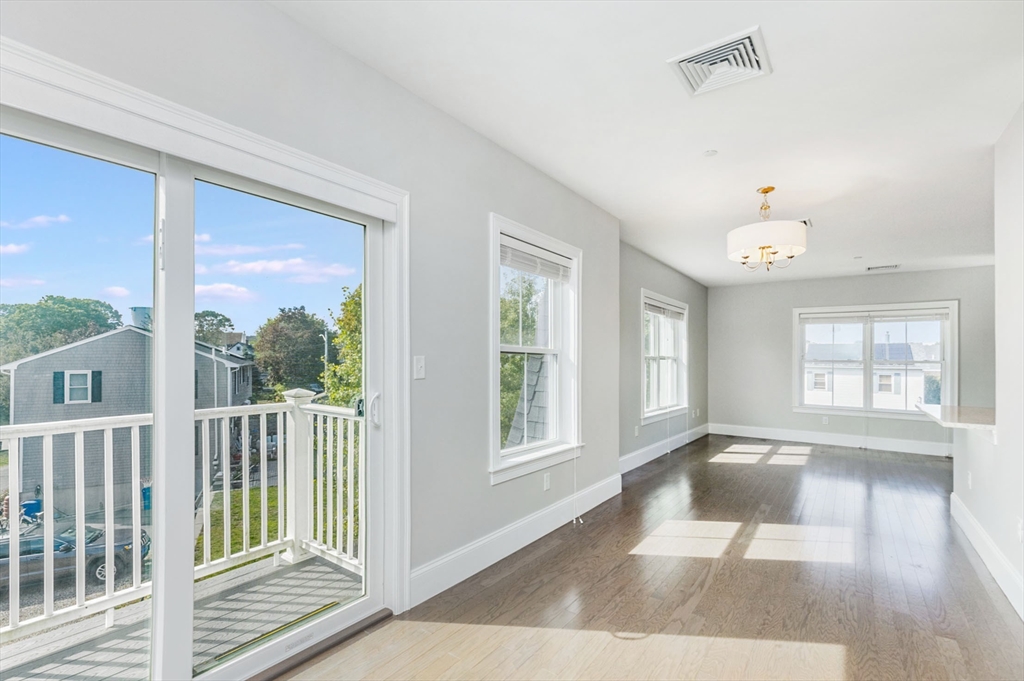 445 Essex Street, Unit 304 Swampscott, MA 01907 - Photo 16 of 35 wooden floor in an empty room with a window