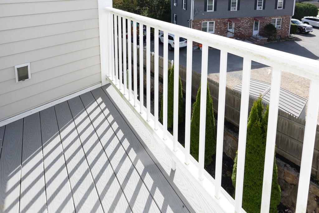 445 Essex Street, Unit 304 Swampscott, MA 01907 - Photo 17 of 35 a view of wooden balcony
