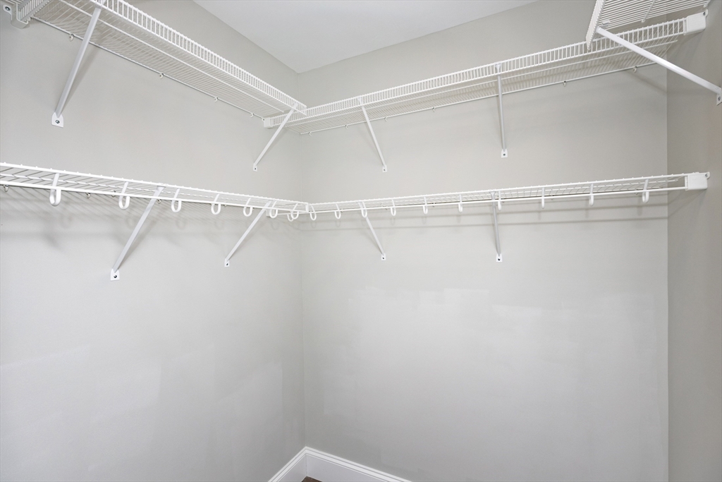 445 Essex Street, Unit 304 Swampscott, MA 01907 - Photo 22 of 35 a view of a room with racks on the wall