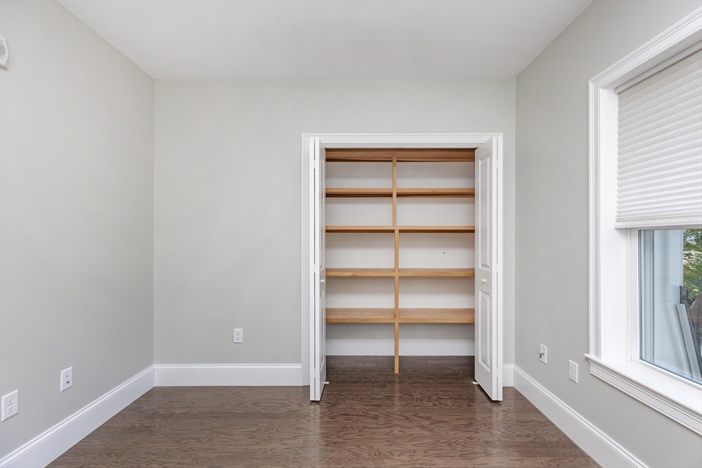 445 Essex Street, Unit 304 Swampscott, MA 01907 - Photo 28 of 35 a view of an empty room with a window