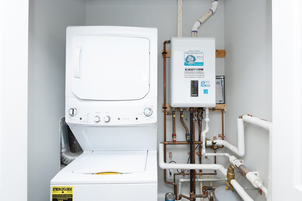445 Essex Street, Unit 304 Swampscott, MA 01907 - Photo 32 of 35 a utility room with dryer and washer