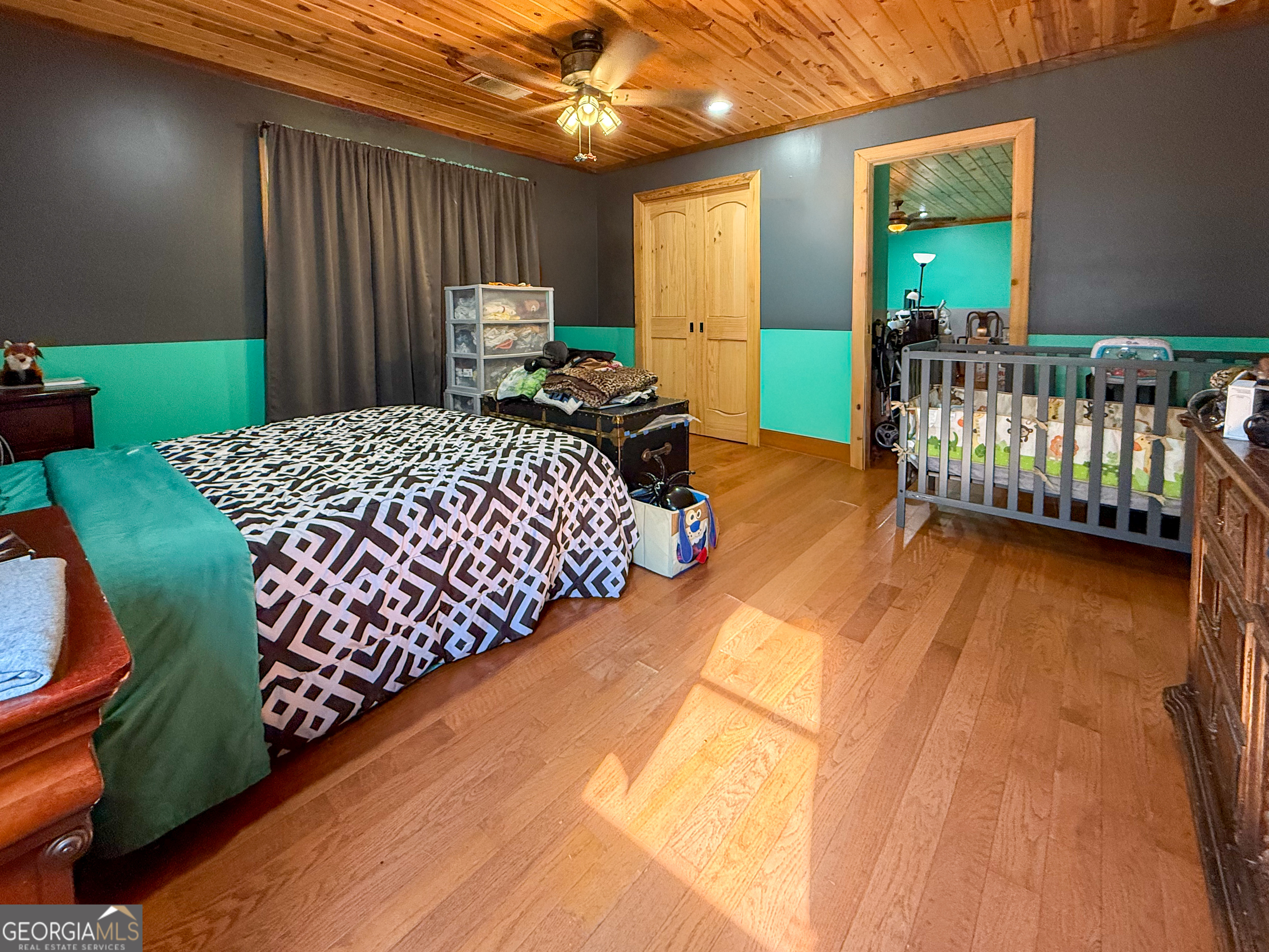 161 Twisting Ridge Trail Demorest, GA 30535 - Photo 18 of 33 a bed sitting in a bedroom next to a window