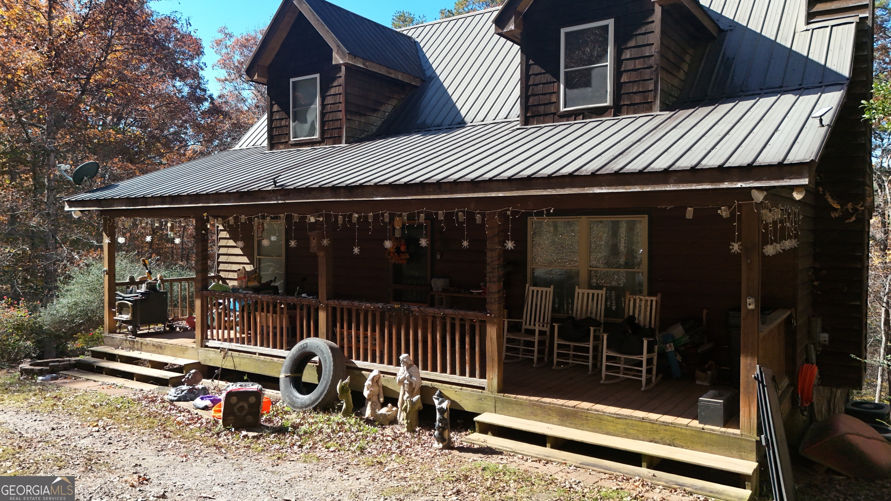 161 Twisting Ridge Trail Demorest, GA 30535 - Photo 2 of 33 a view of a chair and tables in patio