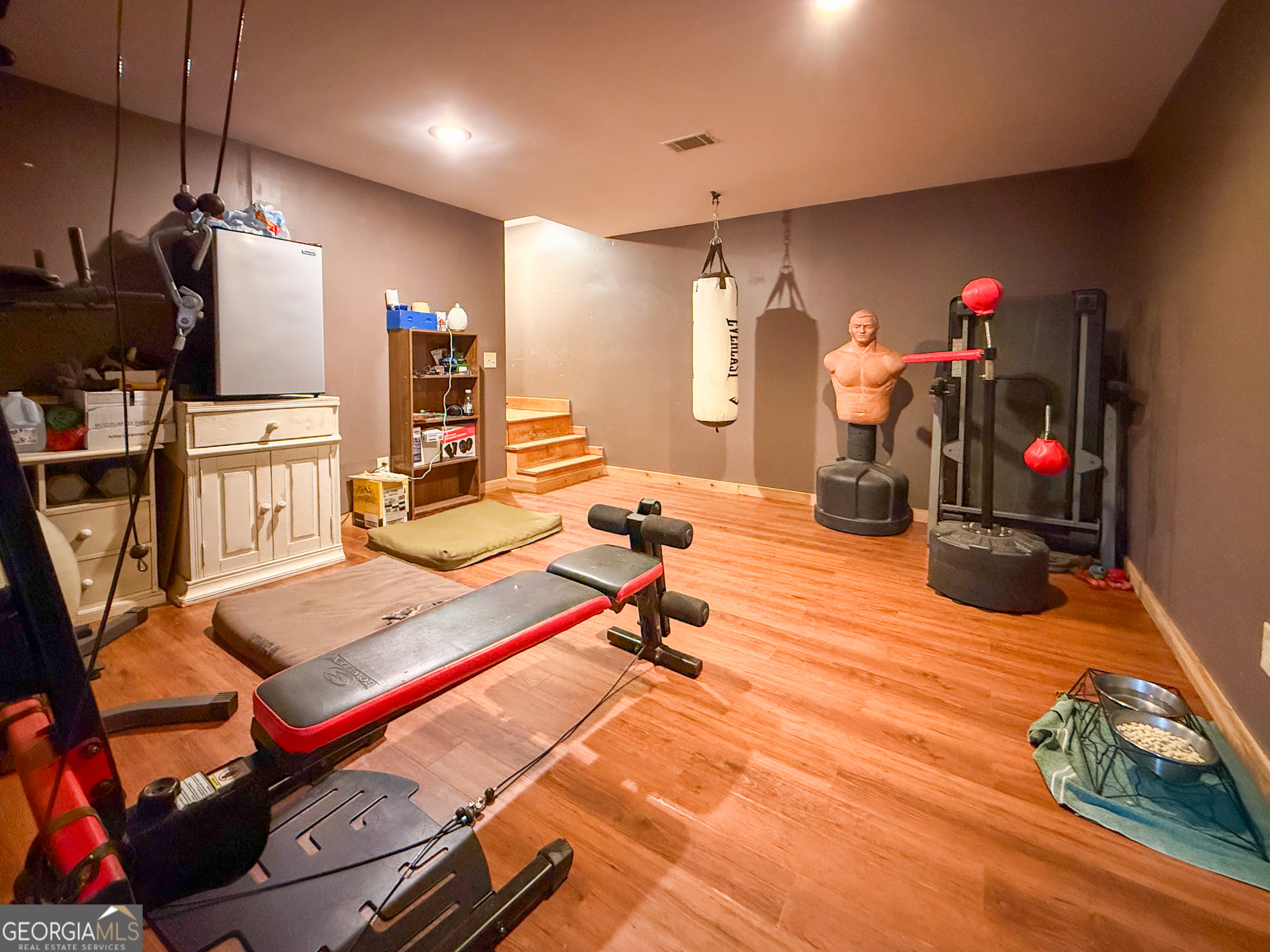 161 Twisting Ridge Trail Demorest, GA 30535 - Photo 23 of 33 a room with gym equipment and wooden floor