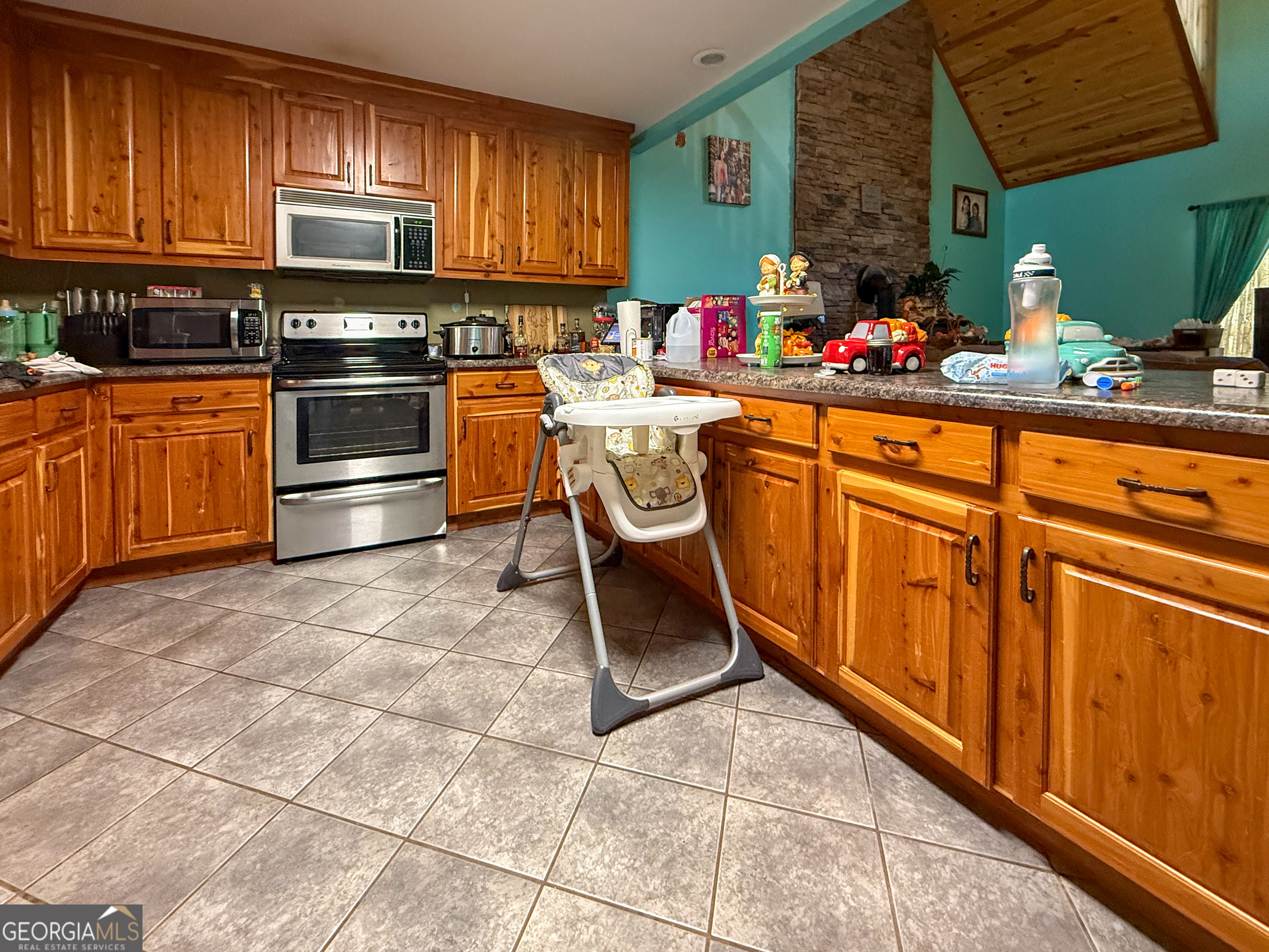 161 Twisting Ridge Trail Demorest, GA 30535 - Photo 7 of 33 a kitchen with stainless steel appliances a stove top oven a sink dishwasher and cabinets with wooden floor