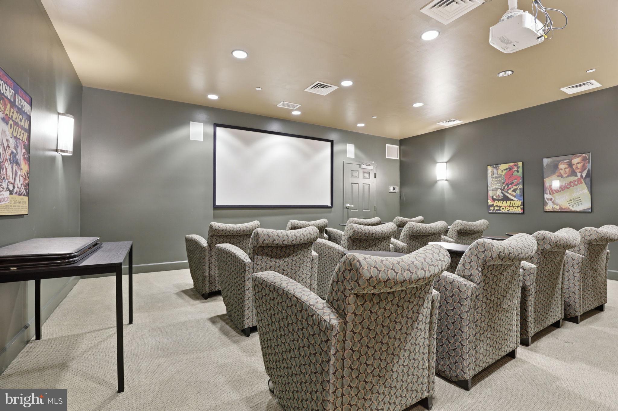 11800 Sunset Hills Road, Unit 218 Reston, VA 20190 - Photo 8 of 38 a living room with furniture a projector and a projector