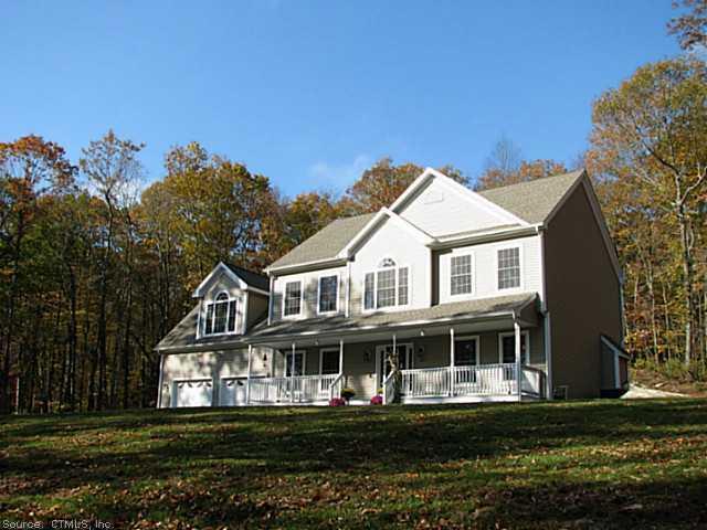63 Jackson Road Haddam, CT 06441 - Photo 1 of 1 a front view of a house with a garden