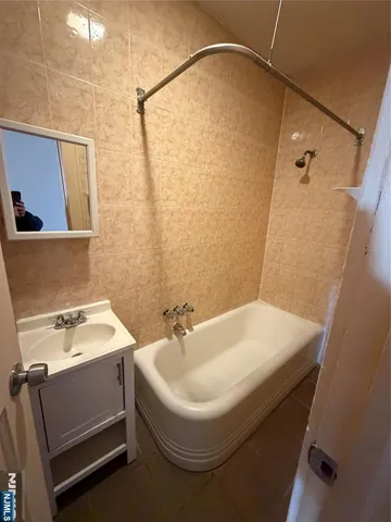 a bathroom with a sink and mirror