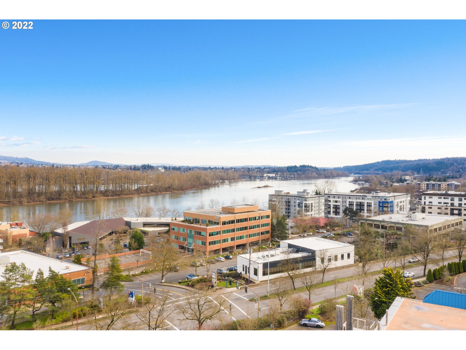 4530 South Kelly Avenue Portland, OR 97239 - Photo 11 of 30 a view of a lake with building in front of it