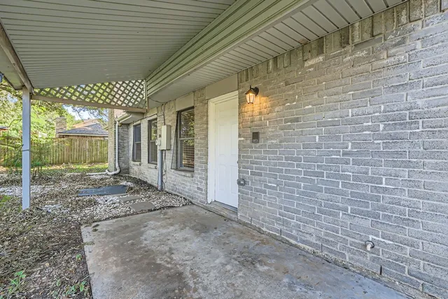 a view of house with a yard