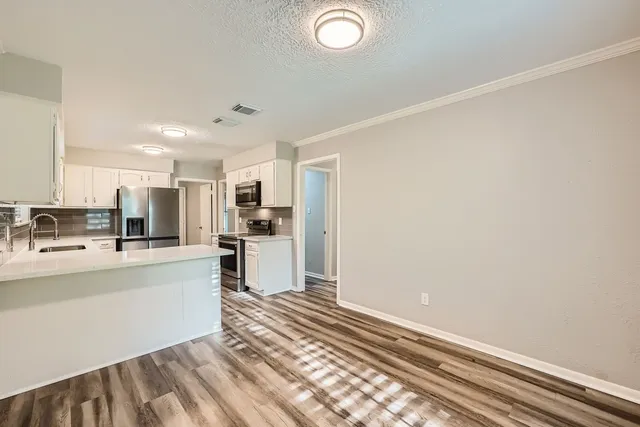 a view of kitchen with wooden floor