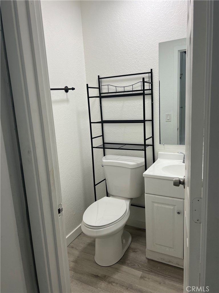 136 West 53rd Street, Unit A Long Beach, CA 90805 - Photo 8 of 13 a white toilet sitting next to a sink