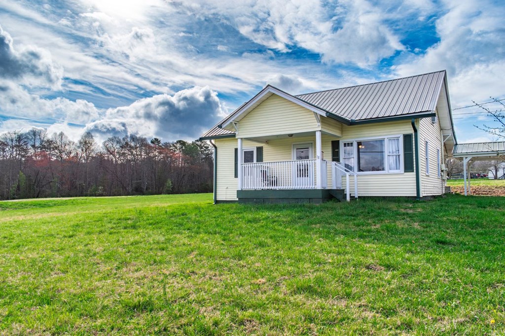 9340 Old Highway 76 Morganton, GA 30560 - Photo 2 of 19 a view of a house with backyard and garden