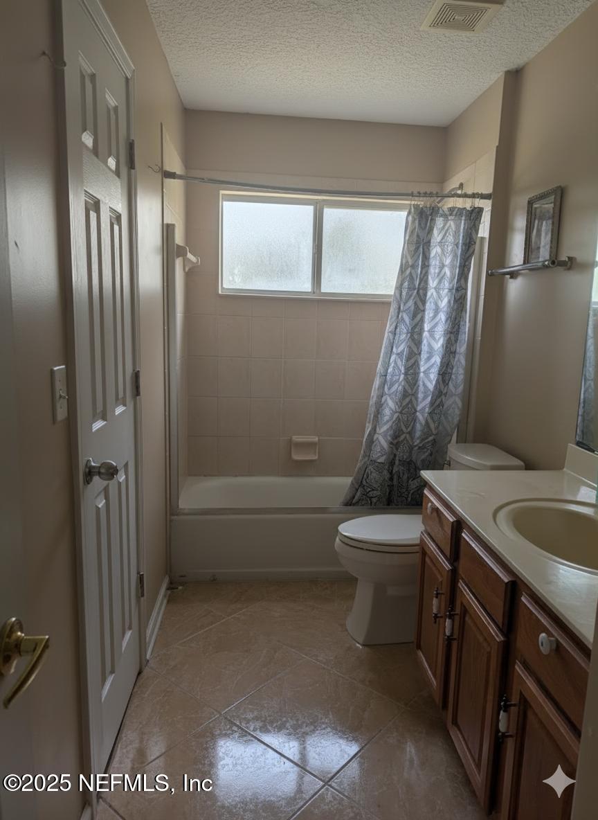 1539 Lockend Court Jacksonville, FL 32221 - Photo 12 of 23 a bathroom with a granite countertop sink toilet and shower