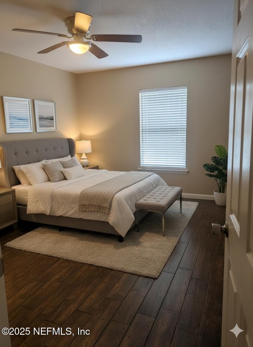 1539 Lockend Court Jacksonville, FL 32221 - Photo 13 of 23 a bedroom with a bed and a chandelier