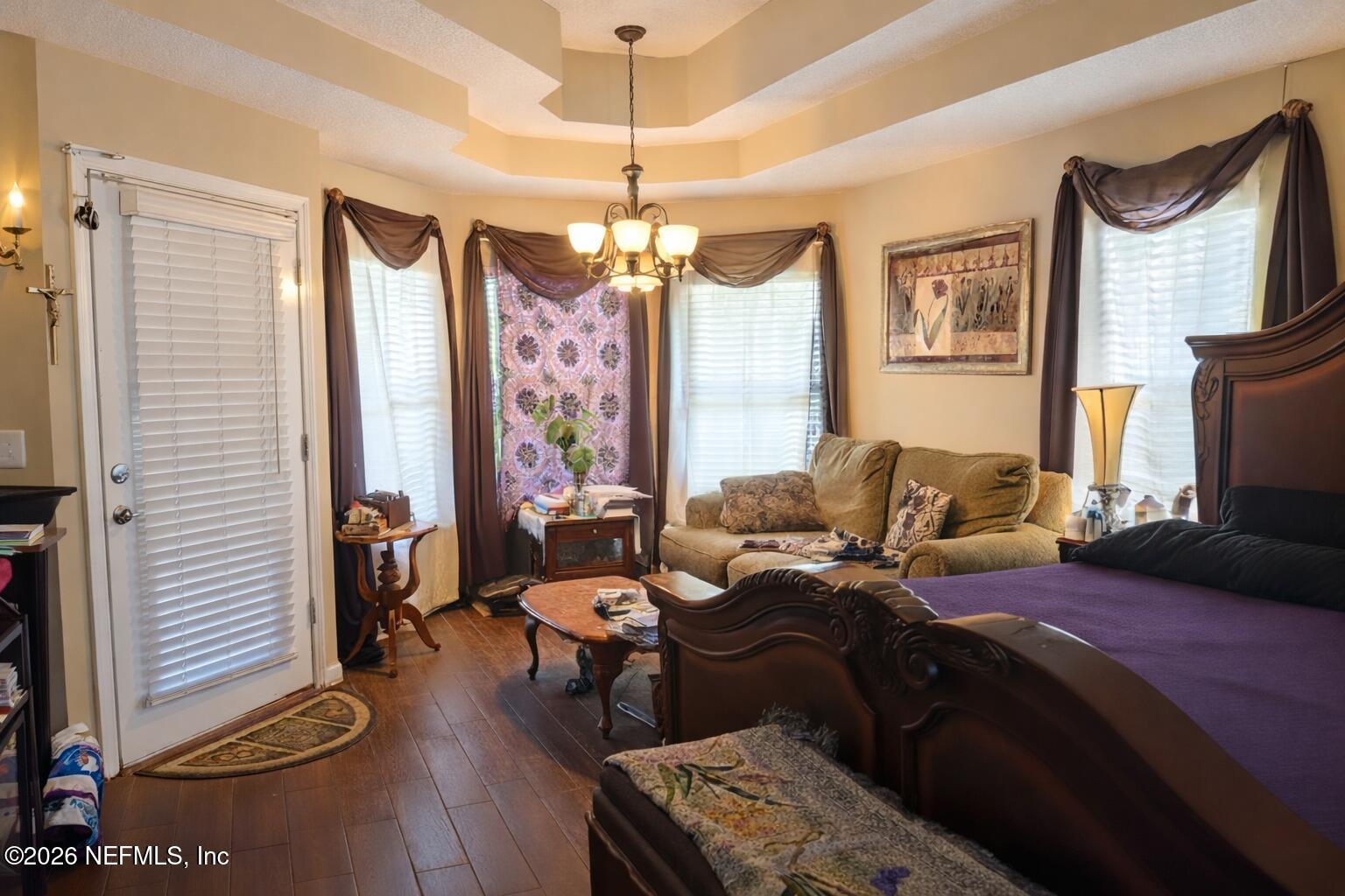 1539 Lockend Court Jacksonville, FL 32221 - Photo 15 of 24 a bedroom with a bed couch and a window