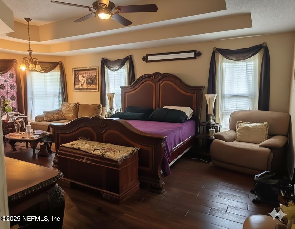 1539 Lockend Court Jacksonville, FL 32221 - Photo 15 of 23 a bedroom with a bed and wooden floor