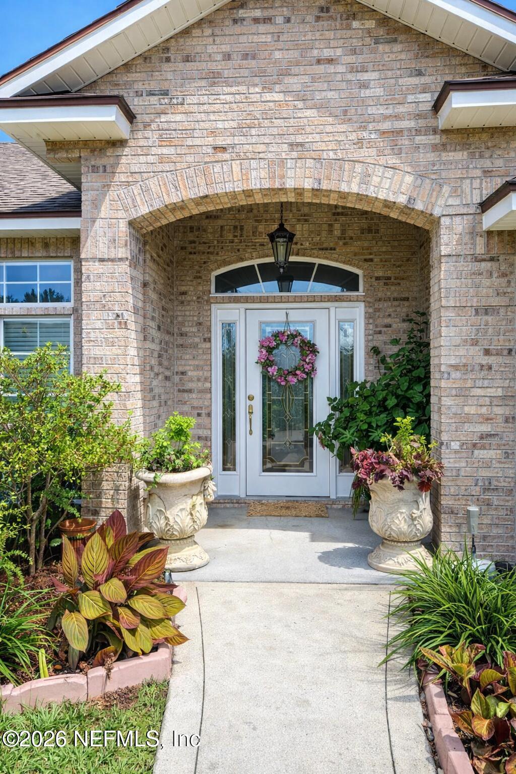 1539 Lockend Court Jacksonville, FL 32221 - Photo 2 of 24 a front view of a house with an outdoor space