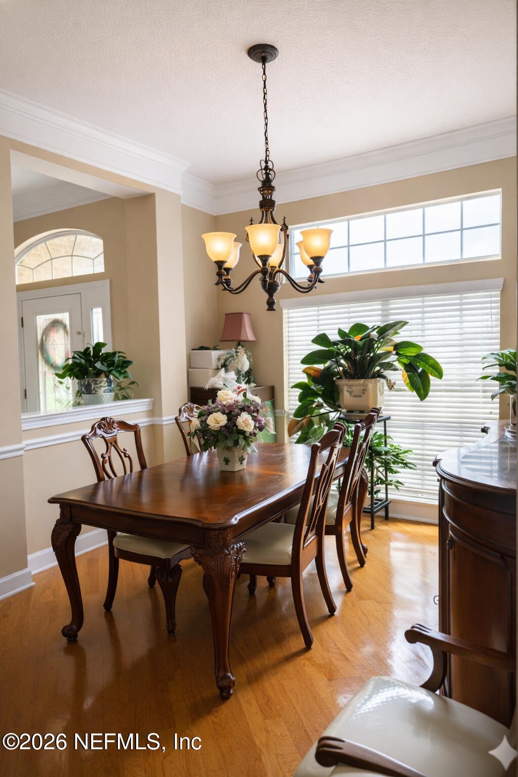 1539 Lockend Court Jacksonville, FL 32221 - Photo 6 of 24 a view of a dining room with furniture window and wooden floor