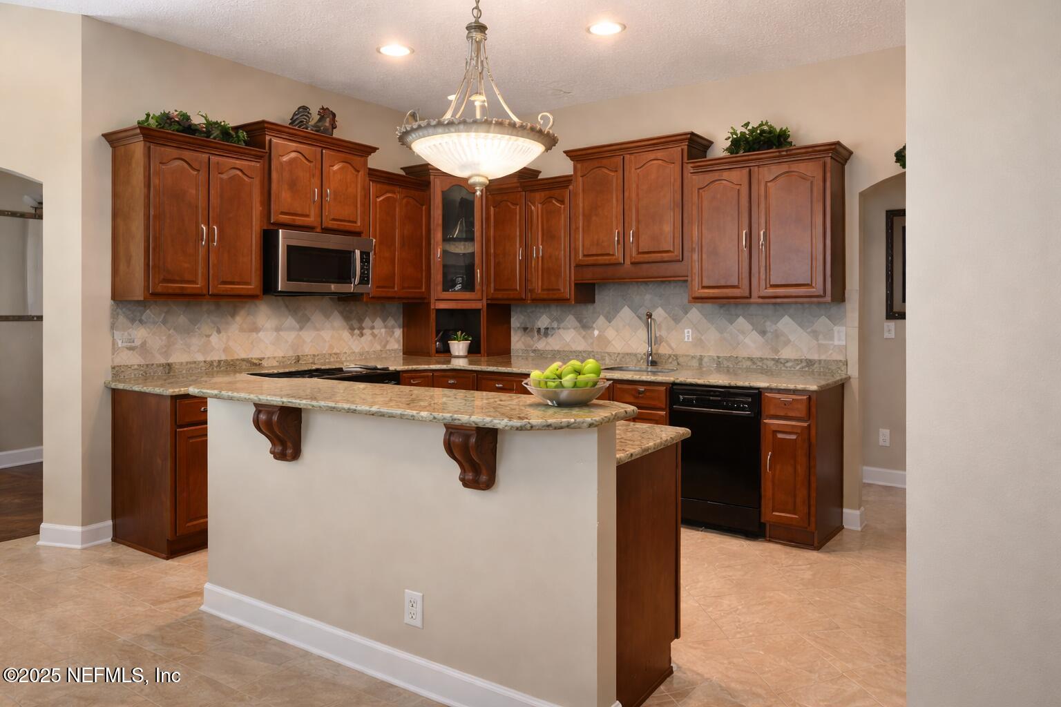 1539 Lockend Court Jacksonville, FL 32221 - Photo 8 of 23 a kitchen with stainless steel appliances granite countertop a stove a sink and a refrigerator