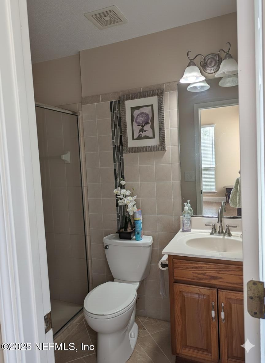1539 Lockend Court Jacksonville, FL 32221 - Photo 10 of 23 a bathroom with a sink toilet and a mirror