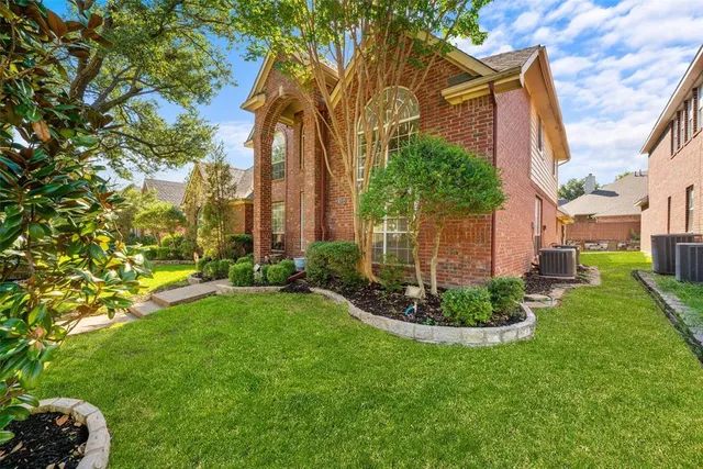 a view of a garden with a house