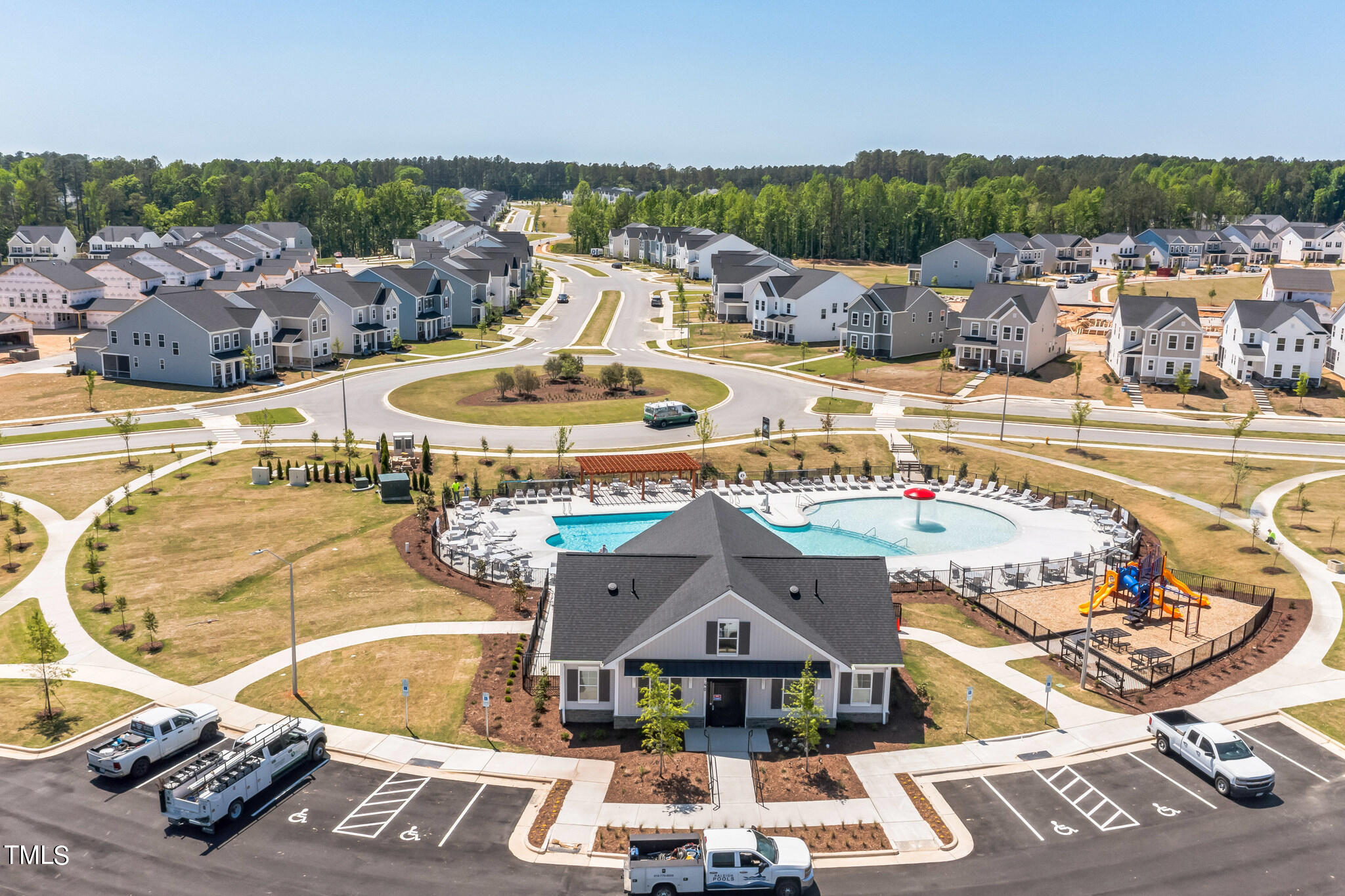 248 Eden Vw Bend, Unit 692 Raleigh, NC 27610 - Photo 18 of 19 a view of a swimming pool with outdoor seating and city view