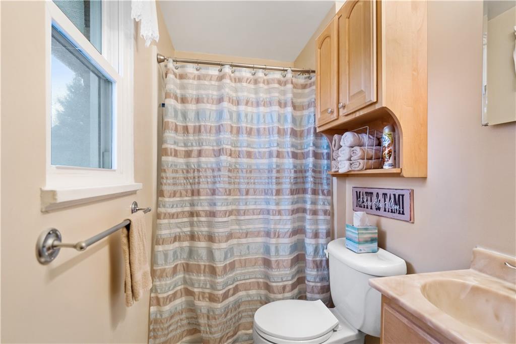 207 Lytton Road Coraopolis, PA 15108 - Photo 14 of 25 a white toilet sitting next to a bathroom sink