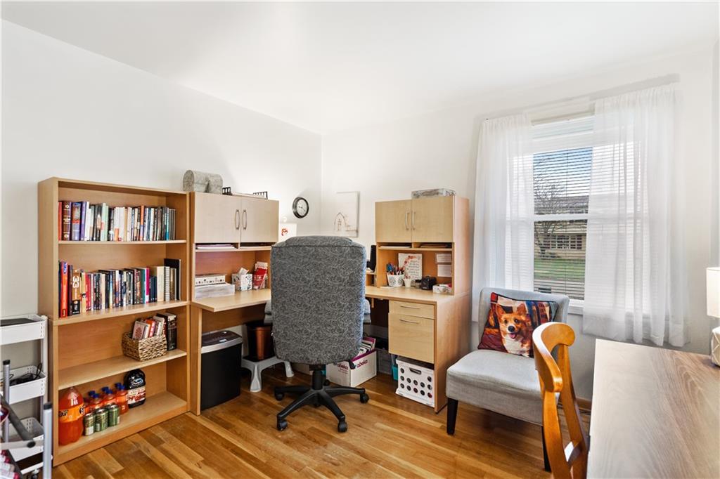 207 Lytton Road Coraopolis, PA 15108 - Photo 18 of 25 a view of a workspace with furniture and a book shelf