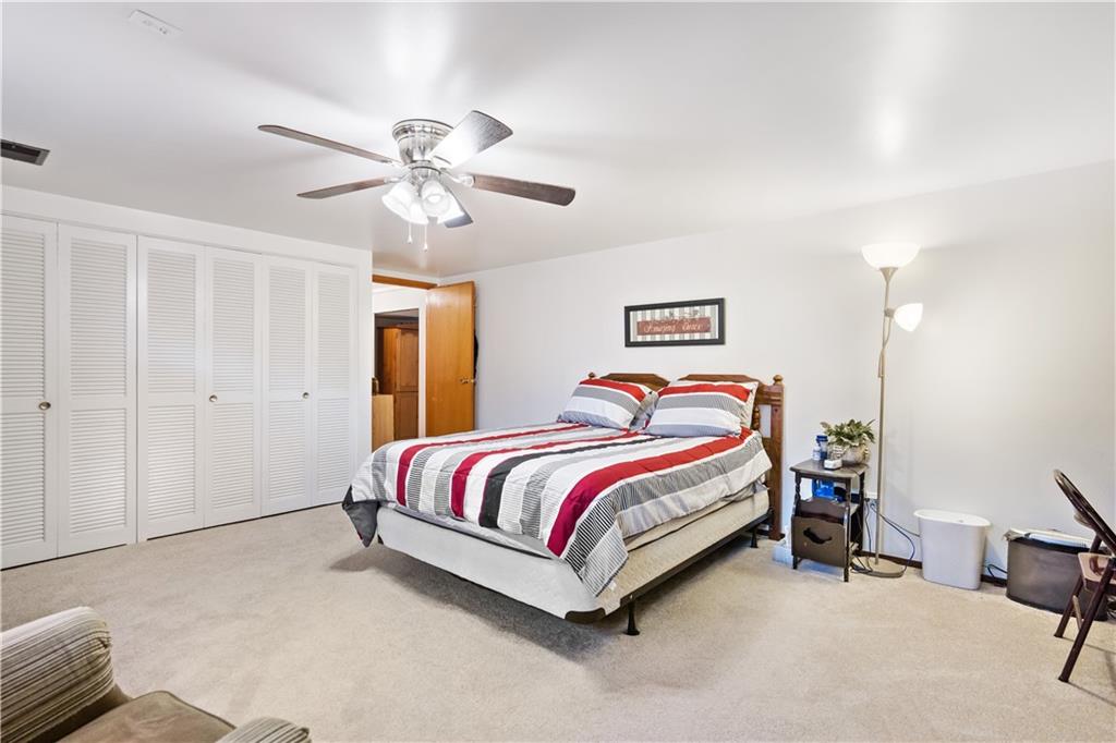 207 Lytton Road Coraopolis, PA 15108 - Photo 23 of 25 a bedroom with a bed and a chandelier