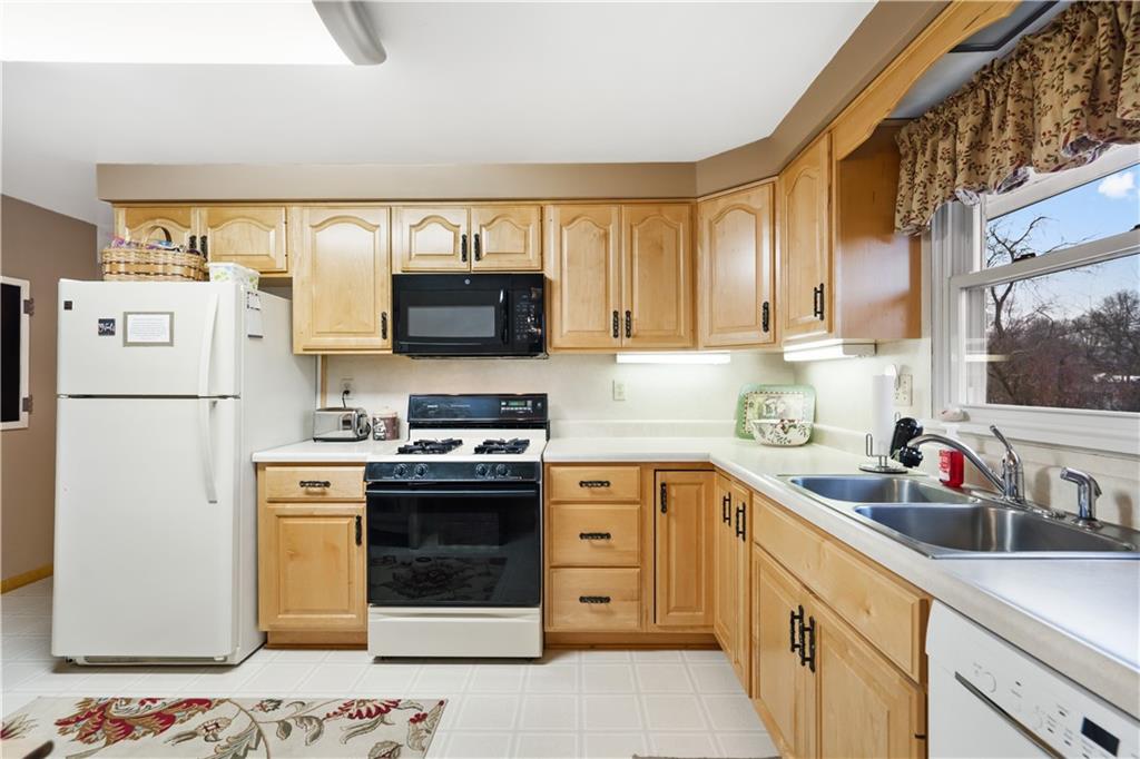 207 Lytton Road Coraopolis, PA 15108 - Photo 8 of 25 a kitchen with a sink stove and refrigerator