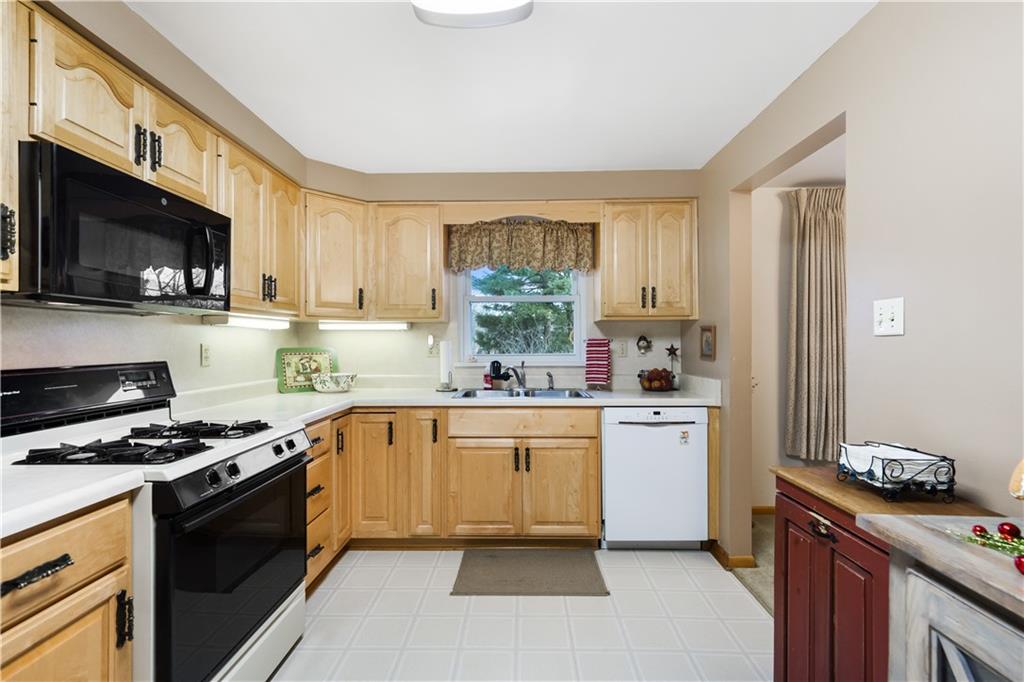 207 Lytton Road Coraopolis, PA 15108 - Photo 10 of 25 a kitchen with a sink a stove and cabinets
