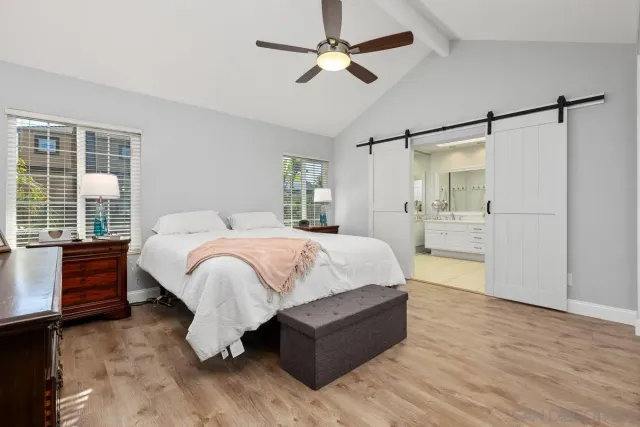 a bed room with a bed and a chandelier